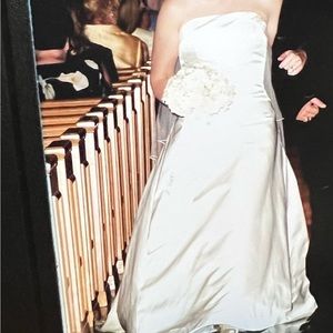 Cream satin strapless wedding dress with button detail on back. Size 6